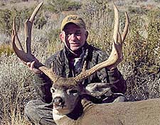 John Fletcher with a 30 inch wide Mule Deer