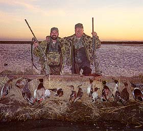 Father and son team of Dwight and Don  Reeve with their limits of ducks.